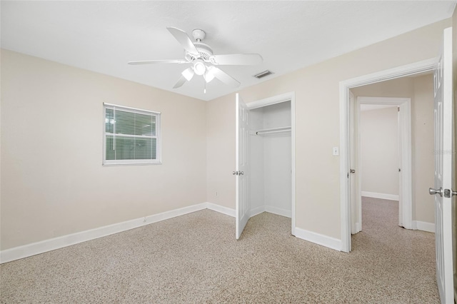 unfurnished bedroom with light speckled floor, visible vents, a closet, baseboards, and ceiling fan