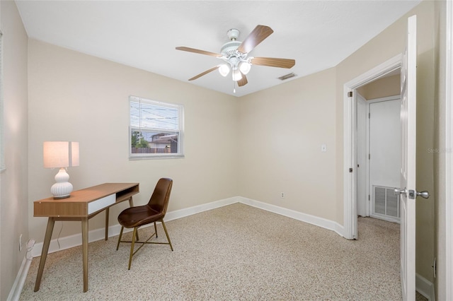 office area with baseboards, visible vents, speckled floor, and ceiling fan