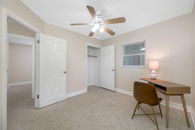 home office featuring baseboards and ceiling fan