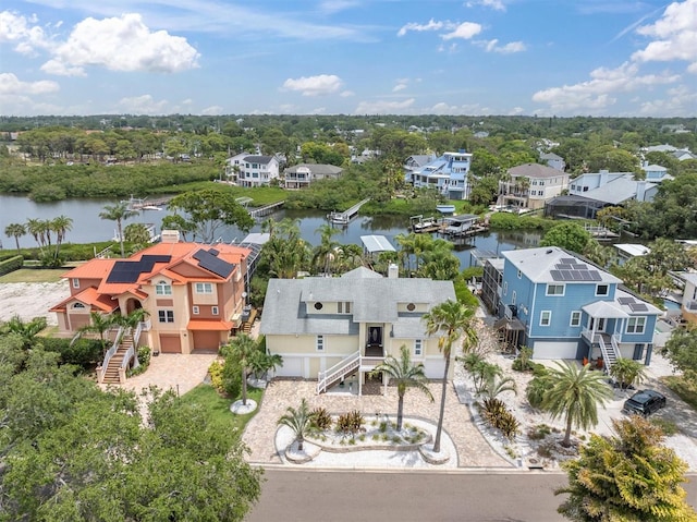 aerial perspective of suburban area with a nearby body of water