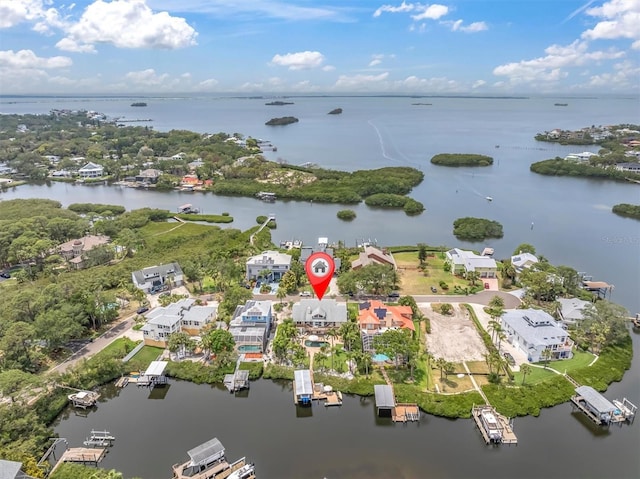 aerial perspective of suburban area with a large body of water
