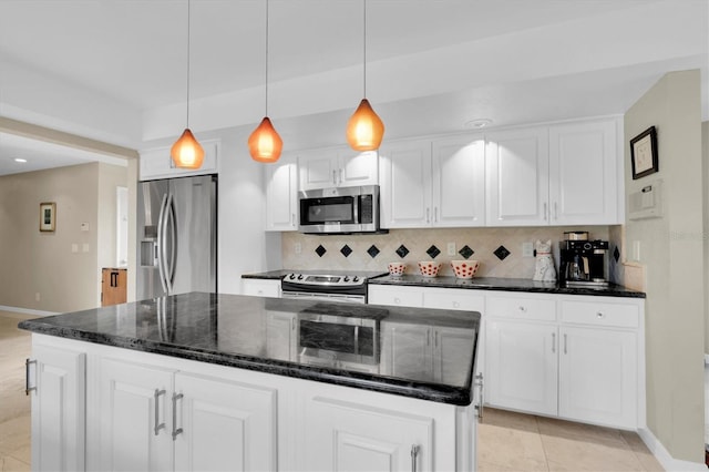 kitchen featuring appliances with stainless steel finishes, baseboards, backsplash, and white cabinets