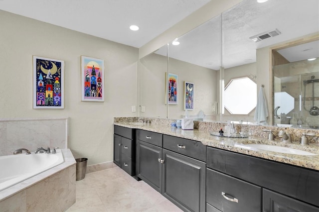 full bathroom featuring a stall shower, double vanity, a bath, and recessed lighting