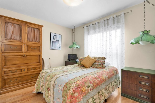 bedroom with wood finished floors