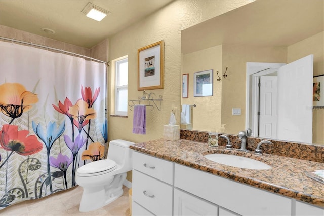 full bath featuring a textured wall, vanity, toilet, tile patterned floors, and a shower with shower curtain