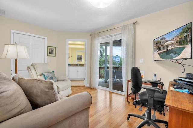 office area with light wood-type flooring