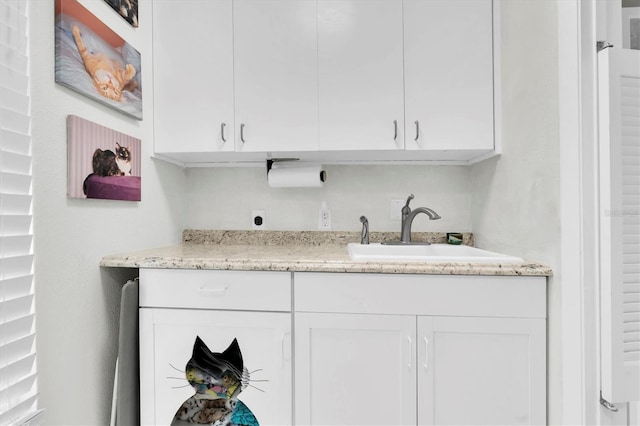 bar featuring a sink