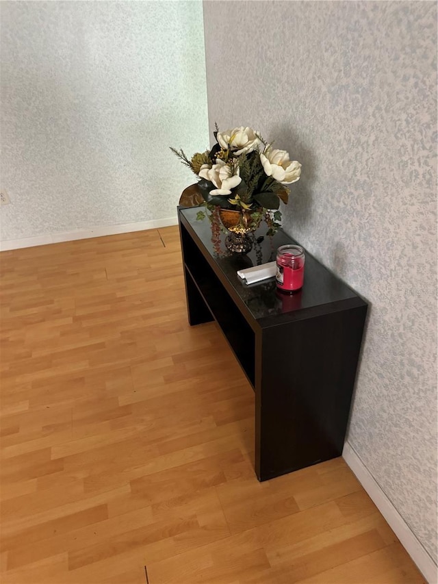 9900 Ideal Ln, Hudson, FL 34667 - detailed view of wood finished floors, baseboards, and wallpapered walls