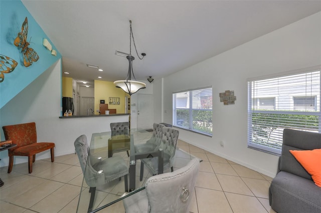 dining room featuring baseboards, light tile patterned flooring, and recessed lighting