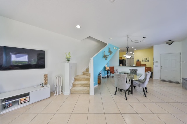 dining area featuring recessed lighting, stairway, and light tile patterned floors