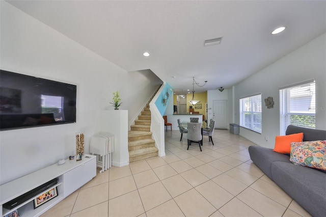 living room featuring baseboards, visible vents, recessed lighting, stairs, and light tile patterned floors