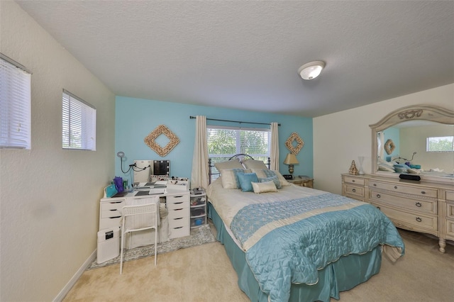 bedroom featuring carpet floors and a textured ceiling