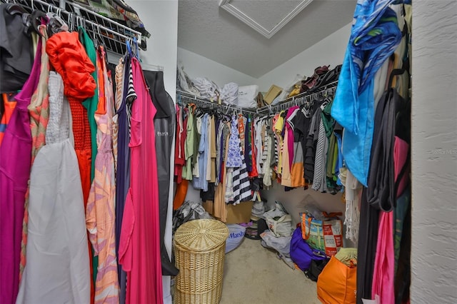 walk in closet featuring attic access