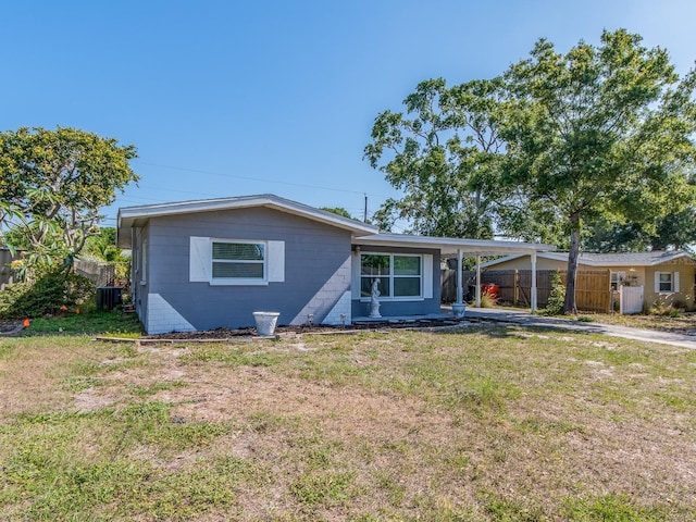 11397 122nd Ave, Largo, FL 33778 - view of front of home with an attached carport, central AC, and driveway
