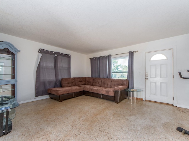 11397 122nd Ave, Largo, FL 33778 - living room featuring speckle patterned floor and baseboards