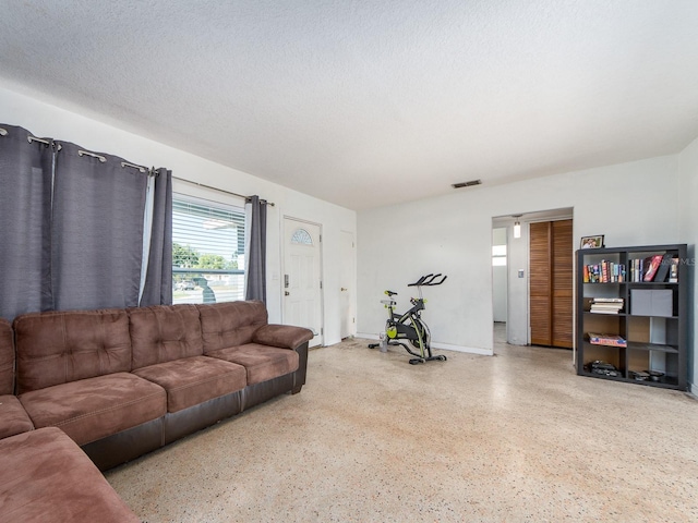 11397 122nd Ave, Largo, FL 33778 - living room with speckled floor and baseboards