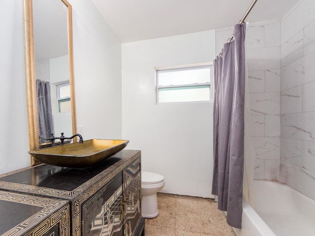 11397 122nd Ave, Largo, FL 33778 - bathroom featuring toilet, speckle patterned floor, vanity, and shower / bath combo with shower curtain