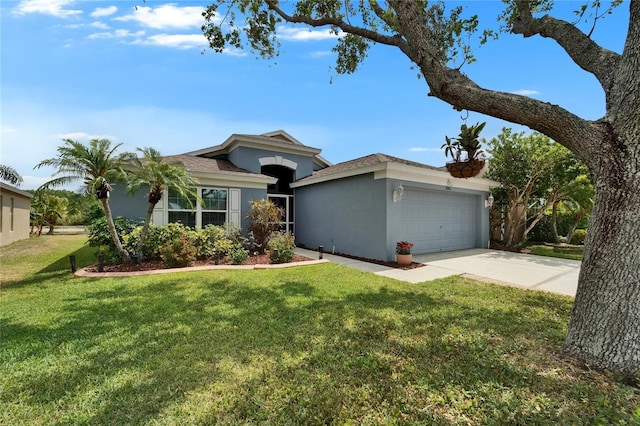 ranch-style house featuring an attached garage, driveway, a front yard, and stucco siding