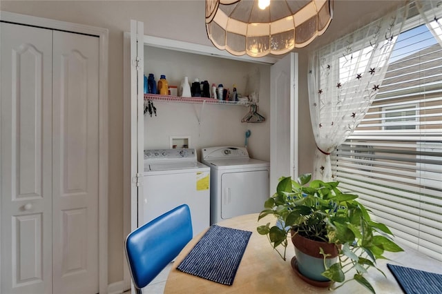 laundry area featuring separate washer and dryer and laundry area