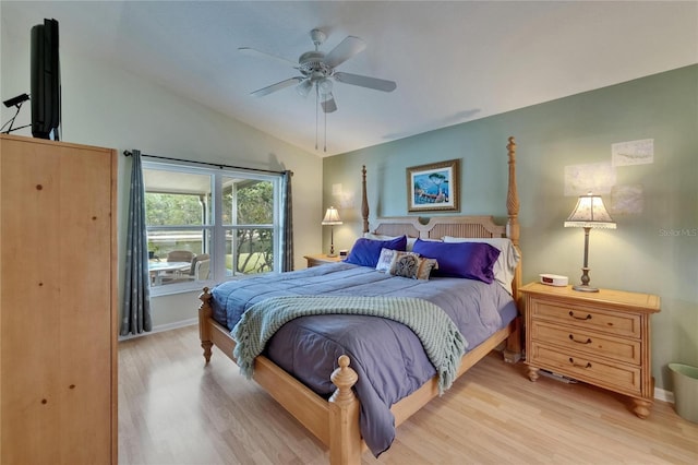 bedroom with baseboards, a ceiling fan, light wood-type flooring, and lofted ceiling