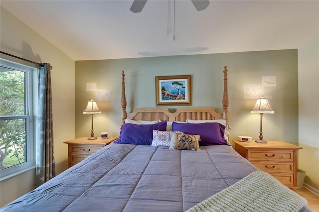 bedroom with ceiling fan and wood finished floors