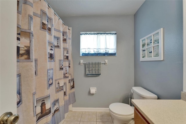 bathroom with vanity, tile patterned floors, toilet, and curtained shower