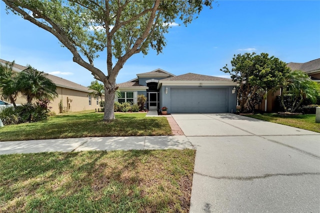 ranch-style house featuring an attached garage, concrete driveway, stucco siding, and a front lawn