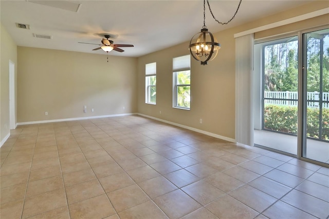 spare room with light tile patterned floors, baseboards, visible vents, and ceiling fan with notable chandelier