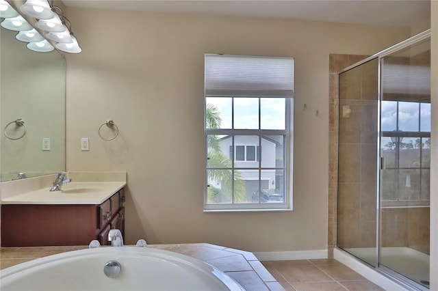 full bath featuring a shower stall, tile patterned flooring, an inviting chandelier, vanity, and a tub