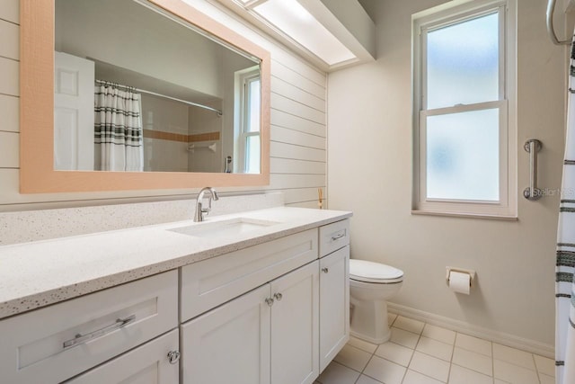 full bath featuring vanity, a shower with curtain, baseboards, toilet, and tile patterned flooring