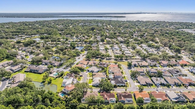 bird's eye view with a residential view and a water view