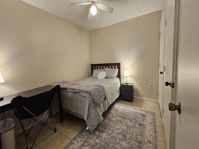 bedroom with light tile patterned flooring and ceiling fan