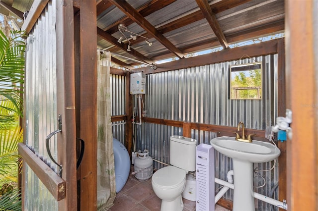 half bathroom featuring a sink and toilet