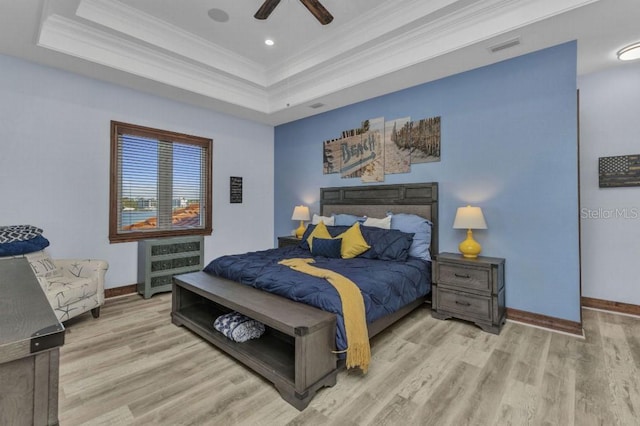 107 Sunset Dr, Nokomis, FL 34275 - bedroom with a ceiling fan, wood finished floors, a raised ceiling, baseboards, and ornamental molding