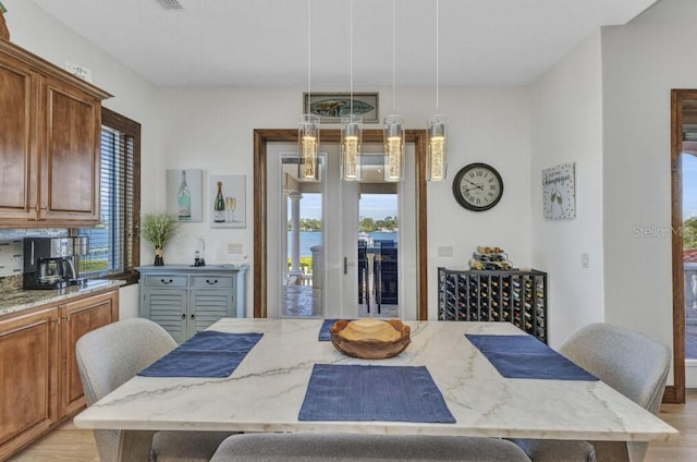 107 Sunset Dr, Nokomis, FL 34275 - dining room featuring light wood-style flooring