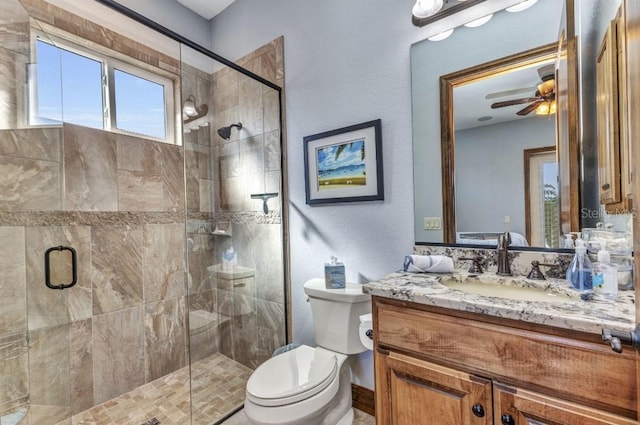 107 Sunset Dr, Nokomis, FL 34275 - bathroom with toilet, a ceiling fan, vanity, and a stall shower