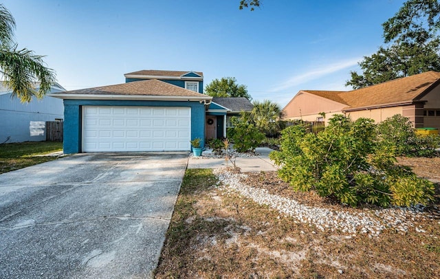 view of front of home with stucco siding, driveway, and an attached garage
