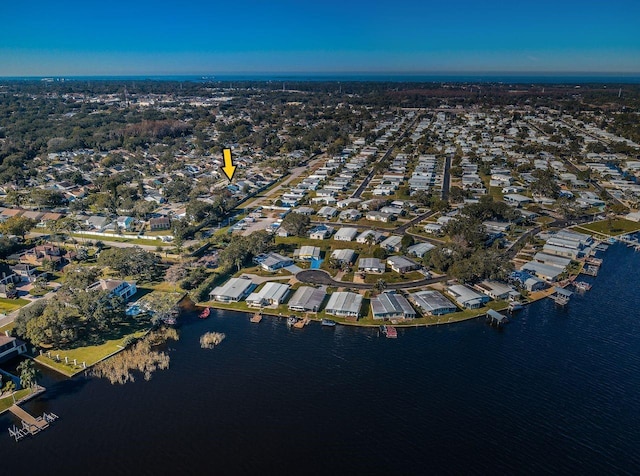 birds eye view of property with a water view and a residential view