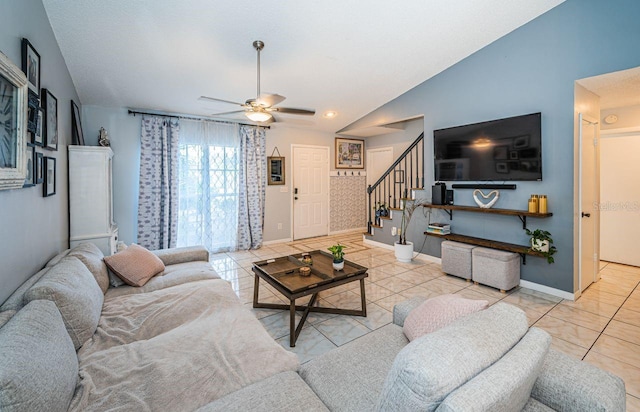 tiled living room with lofted ceiling, stairway, ceiling fan, and baseboards