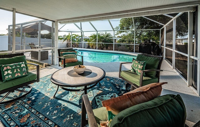 view of swimming pool with glass enclosure, a fenced backyard, a fenced in pool, and a patio area