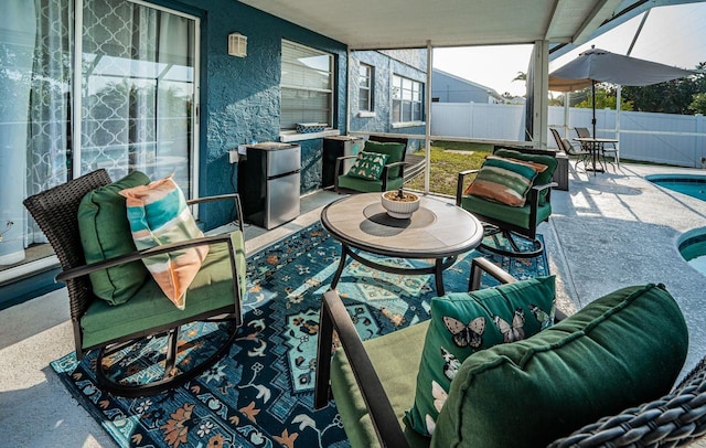 view of patio featuring a fenced in pool, outdoor dining space, and a fenced backyard
