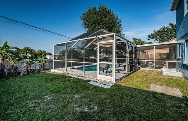 view of swimming pool with a yard, a fenced in pool, and a patio area
