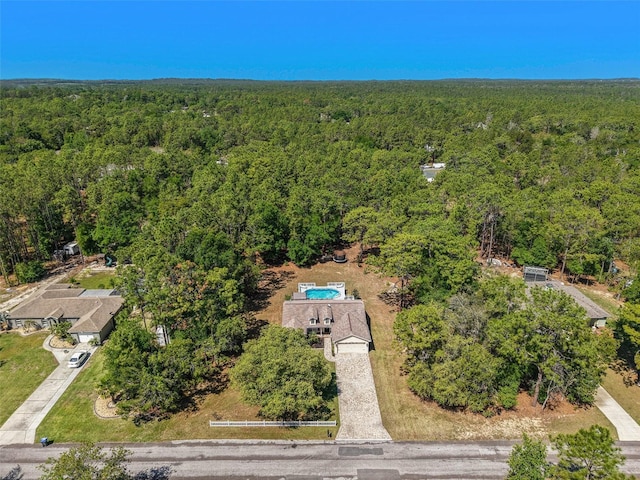 aerial view featuring a view of trees