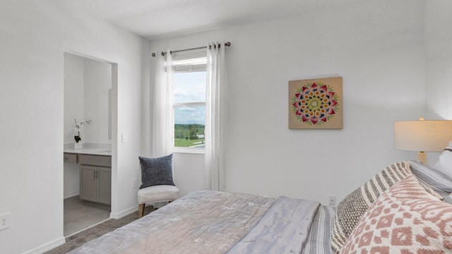 bedroom with carpet flooring and ensuite bathroom