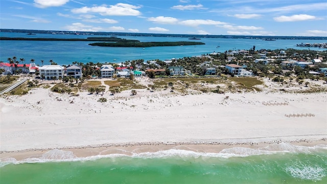 birds eye view of property featuring a water view and a view of the beach