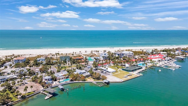 birds eye view of property with a beach view and a water view