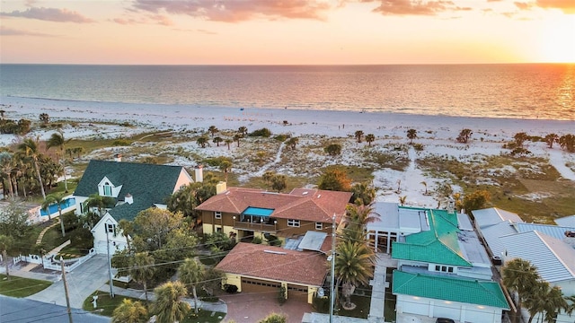 bird's eye view featuring a water view and a beach view