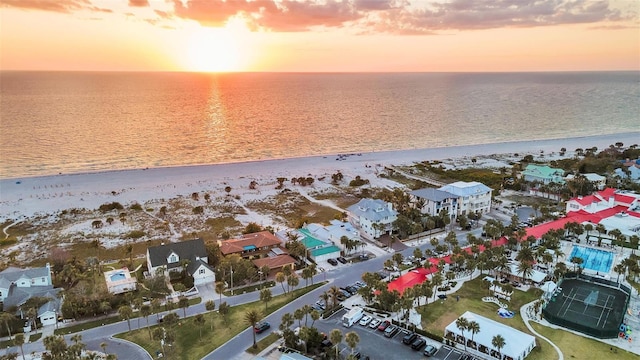 aerial view featuring a water view, a residential view, and a beach view
