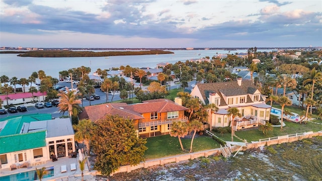 birds eye view of property featuring a water view and a residential view