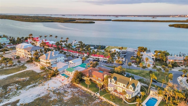 drone / aerial view featuring a water view and a residential view